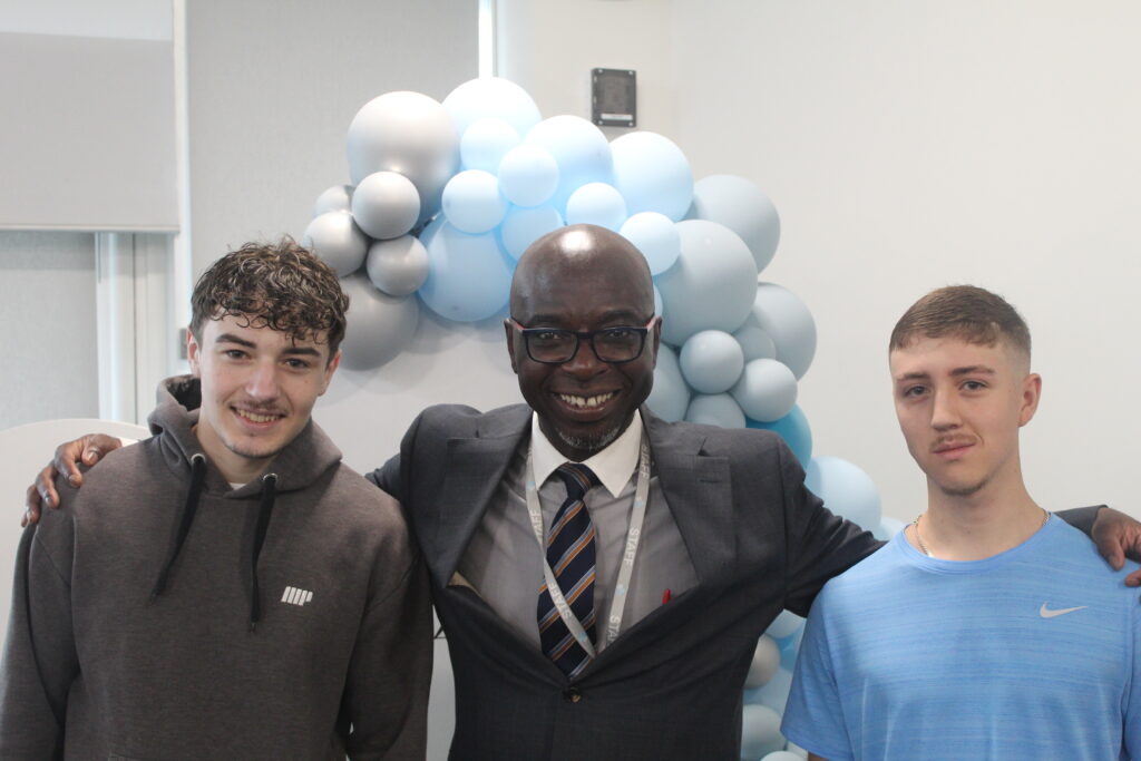 Students stood with Principal Donkor