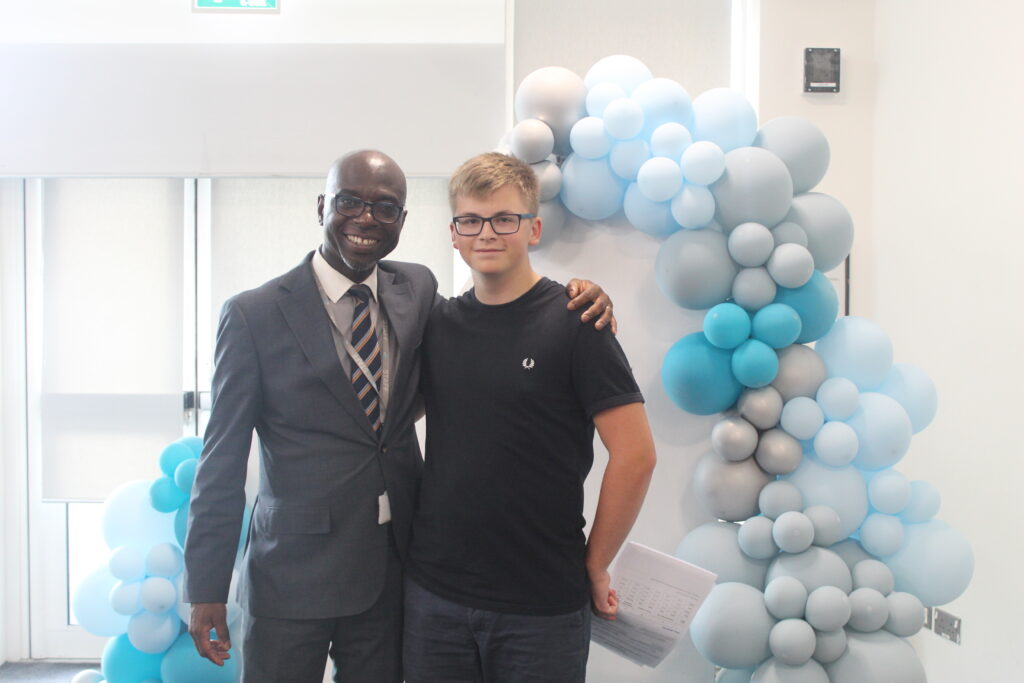 Students stood with Principal Donkor